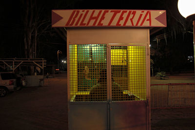 Illuminated text on building at night