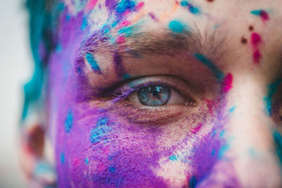 Close-up portrait of man covered with powder paint