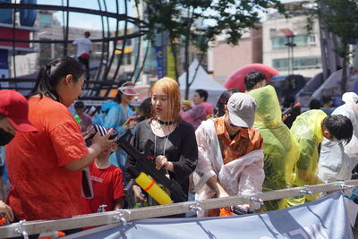 People standing on street in city