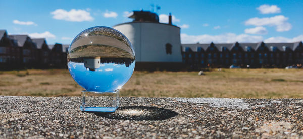 Close-up of crystal ball on field