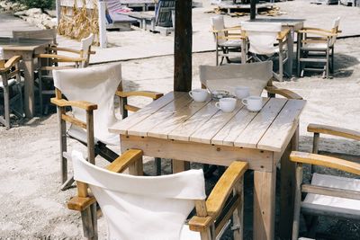 High angle view of empty chairs and table in restaurant