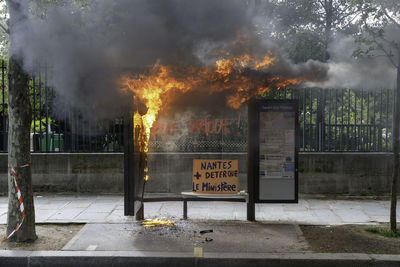 Information sign on fire in city