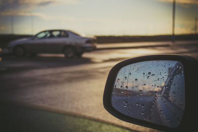 Reflection of road on side-view mirror