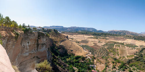 Scenic view of mountains against clear blue sky