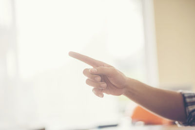 Close-up of businessman gesturing in office