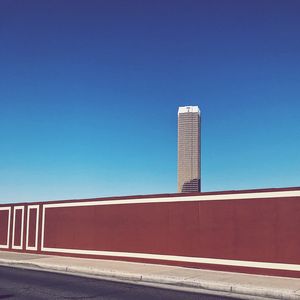 Low angle view of building against clear blue sky