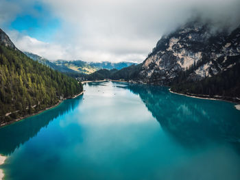 Scenic view of lake and mountains against sky