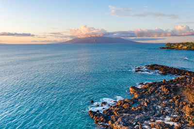 Scenic view of sea against sky at sunset