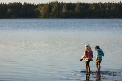 Girls walking in lake