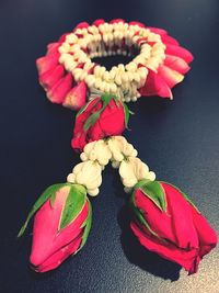 High angle view of red roses on table