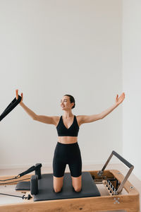 Young woman exercising in gym