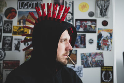 Close-up portrait of young man punk smoking