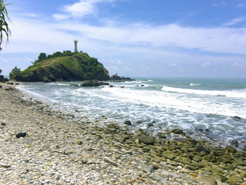 Scenic view of beach against sky