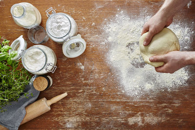 High angle view of person preparing cookies on table