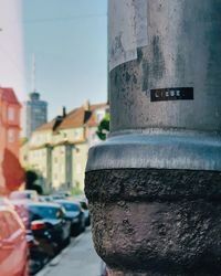 Close-up of text on road against sky