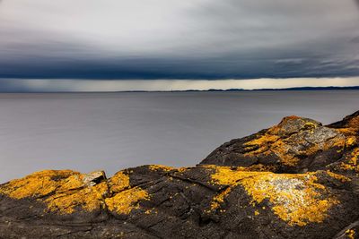 Scenic view of sea against sky during autumn