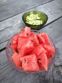 High angle view of chopped fruits in plate on table