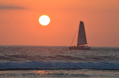 Scenic view of sea against clear sky during sunset