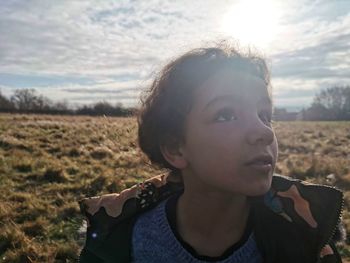 Portrait of teenage girl on field