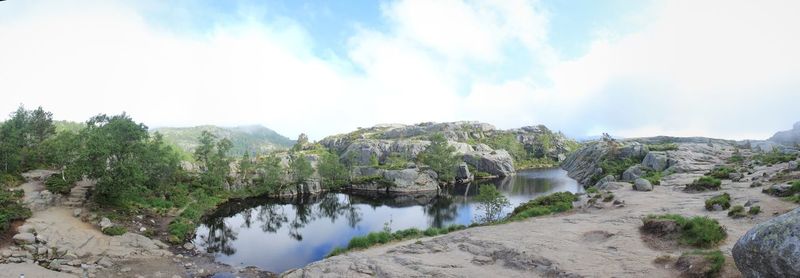 Panoramic view of river and trees against sky