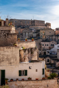 Buildings in city against sky