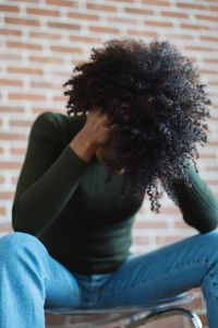 Portrait of a beautiful black woman with afro looking distressed