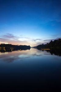 Scenic view of lake against blue sky