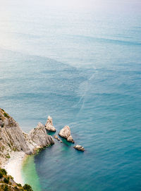 High angle view of rocks in sea