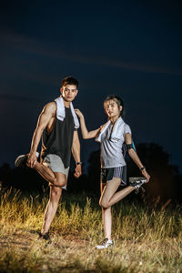 Full length of young couple on land