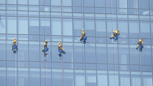 Window washers on modern building