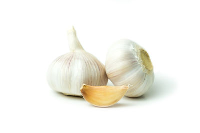 Close-up of garlic over white background