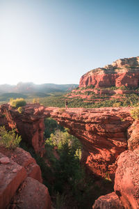 Rock formations on landscape against sky