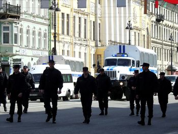 People walking on street in city