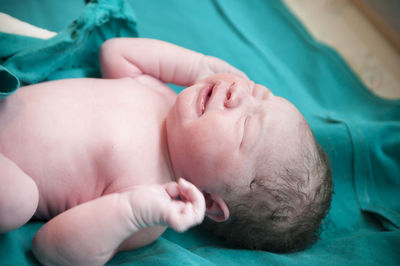 Close-up of baby boy sleeping at home