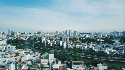 High angle view of buildings in city against sky