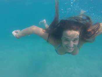 Portrait of woman swimming in sea