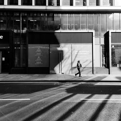 Full length of man walking on road