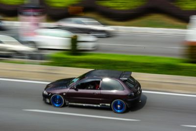 Blurred motion of car on road