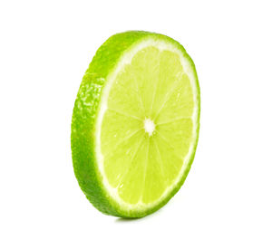 Close-up of lemon slice against white background