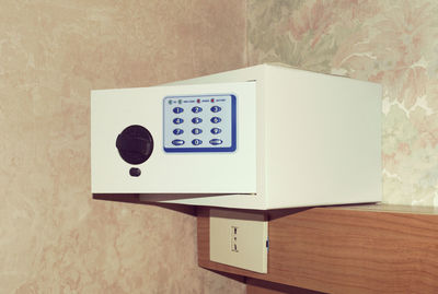 Close-up of information sign on wall at home