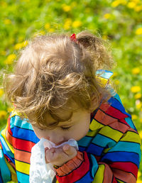 Close-up of cute girl looking away