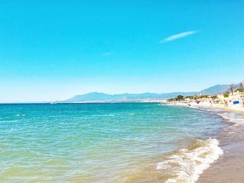 Scenic view of sea against clear blue sky