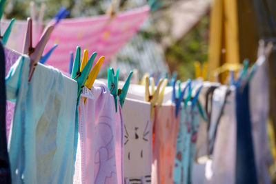 Close-up of clothes drying for sale at market