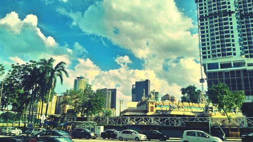 Panoramic view of buildings in city against sky