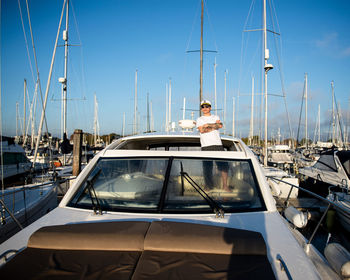 A man standing inside of the yacht