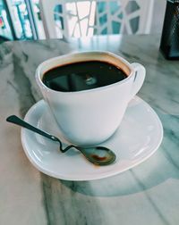 High angle view of coffee cup on table