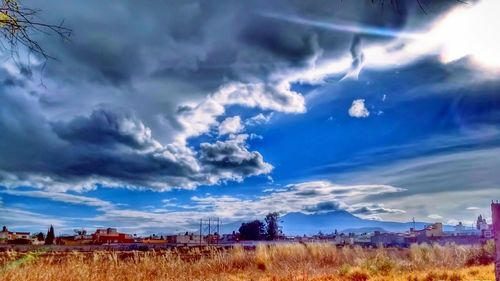 Storm clouds over field