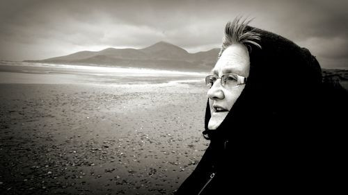 Woman standing on beach