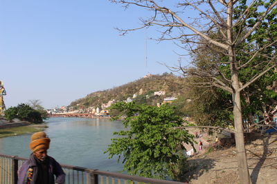 Panoramic view of city by sea against clear sky