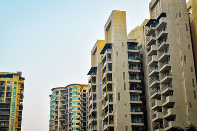 Low angle view of buildings against clear sky